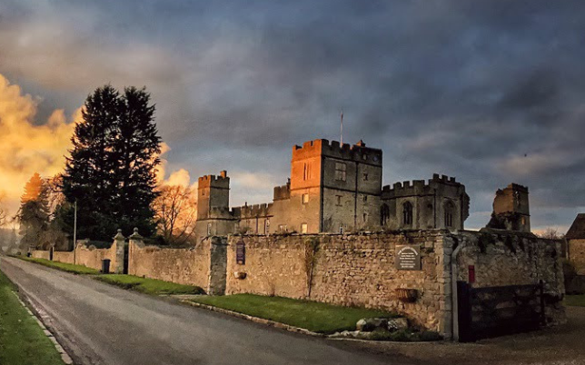 Snape castle with an orange sunset